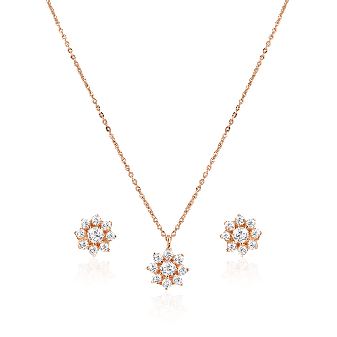 Rose gold floral 925 silver pendant and earrings set styled on pink background