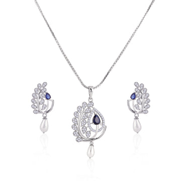 Elegant sapphire and pearl 925 silver necklace and earrings set with cubic zirconia detailing and blue teardrop center stone.