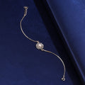 925 silver sunflower pearl bracelet on blue fabric background