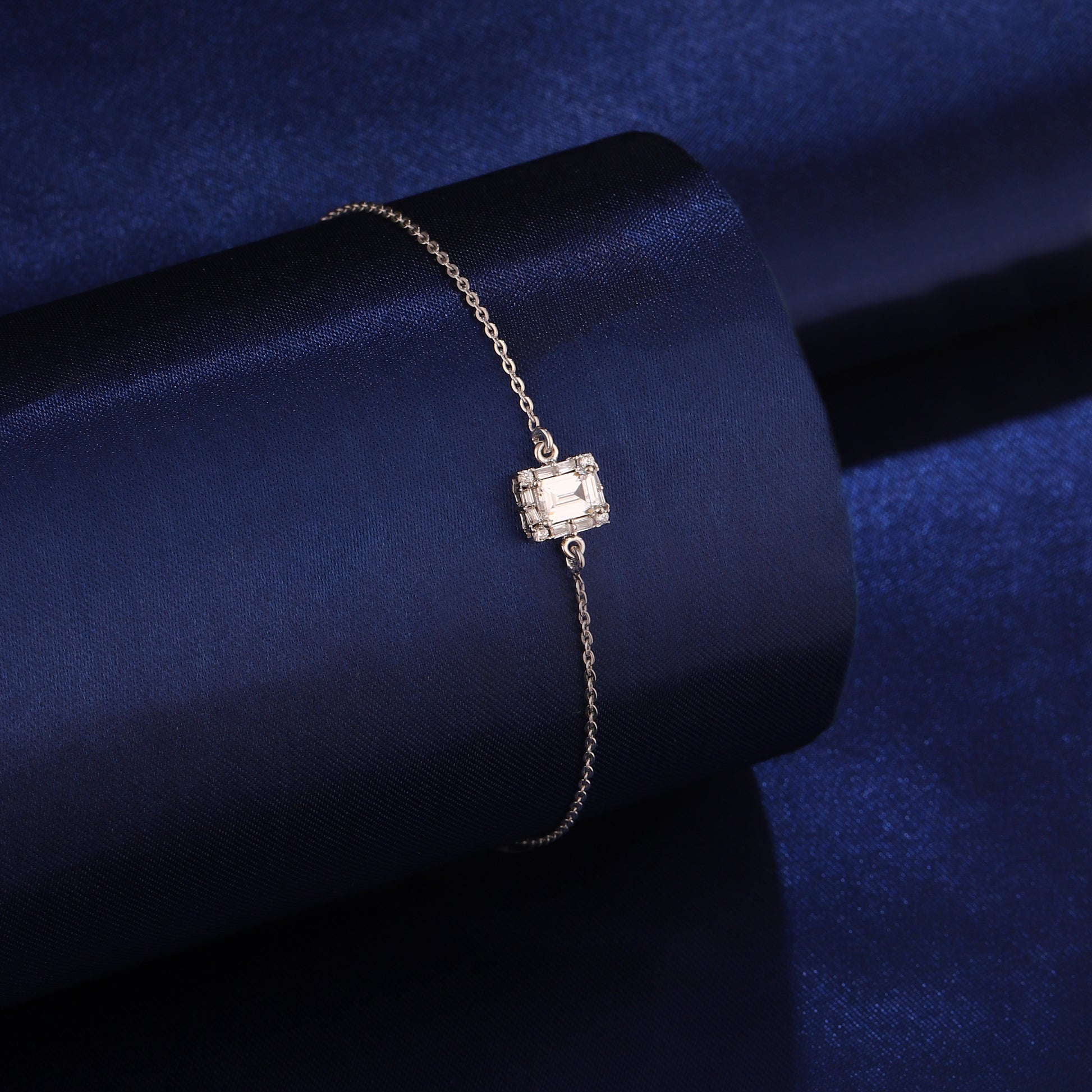 925 silver square emerald-cut bracelet styled on dark blue background