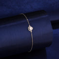 925 silver heart-shaped halo bracelet styled on dark blue background