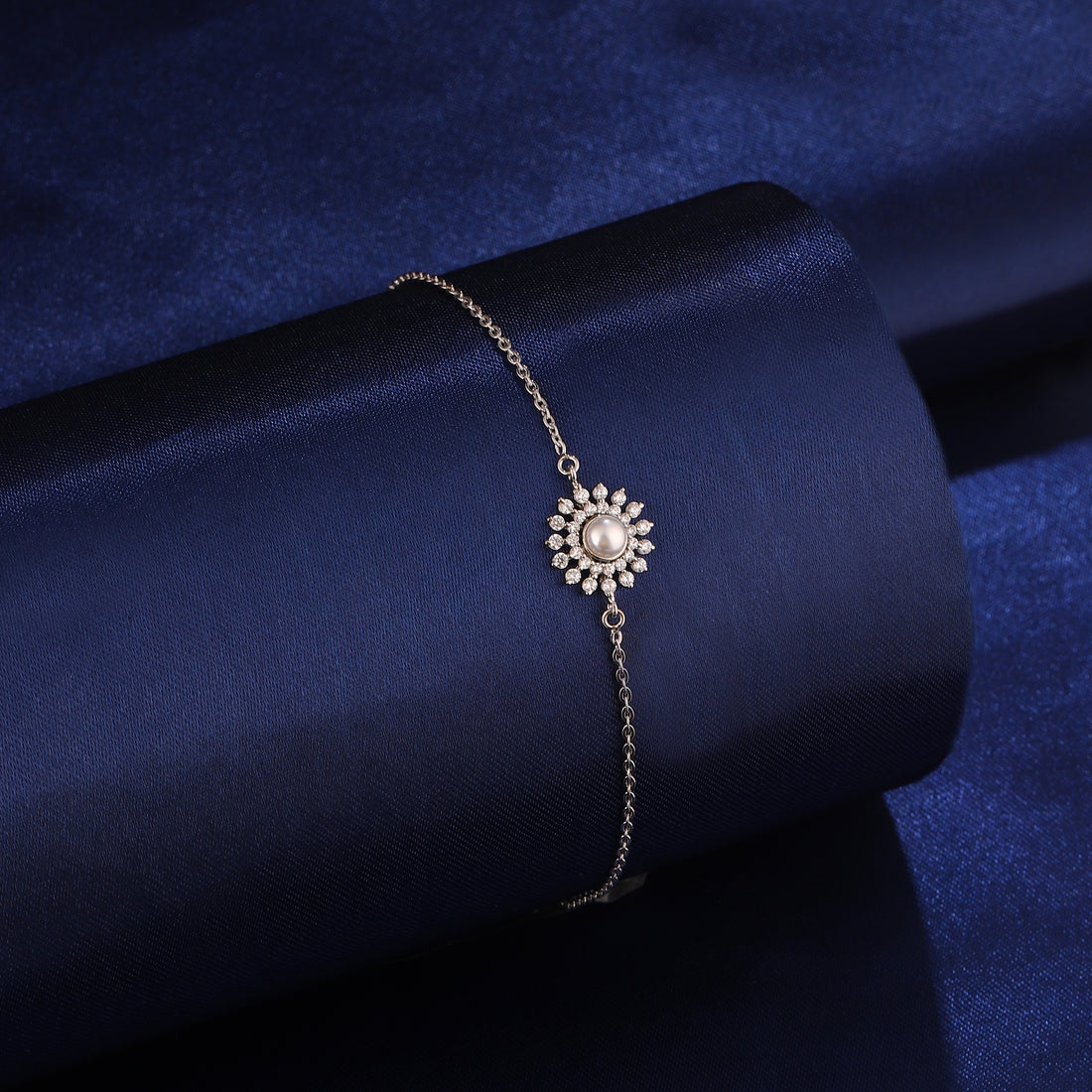 925 silver floral pearl bracelet styled on dark blue background