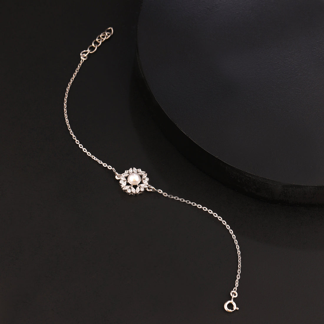 Pearl flower 925 silver bracelet styled on black background