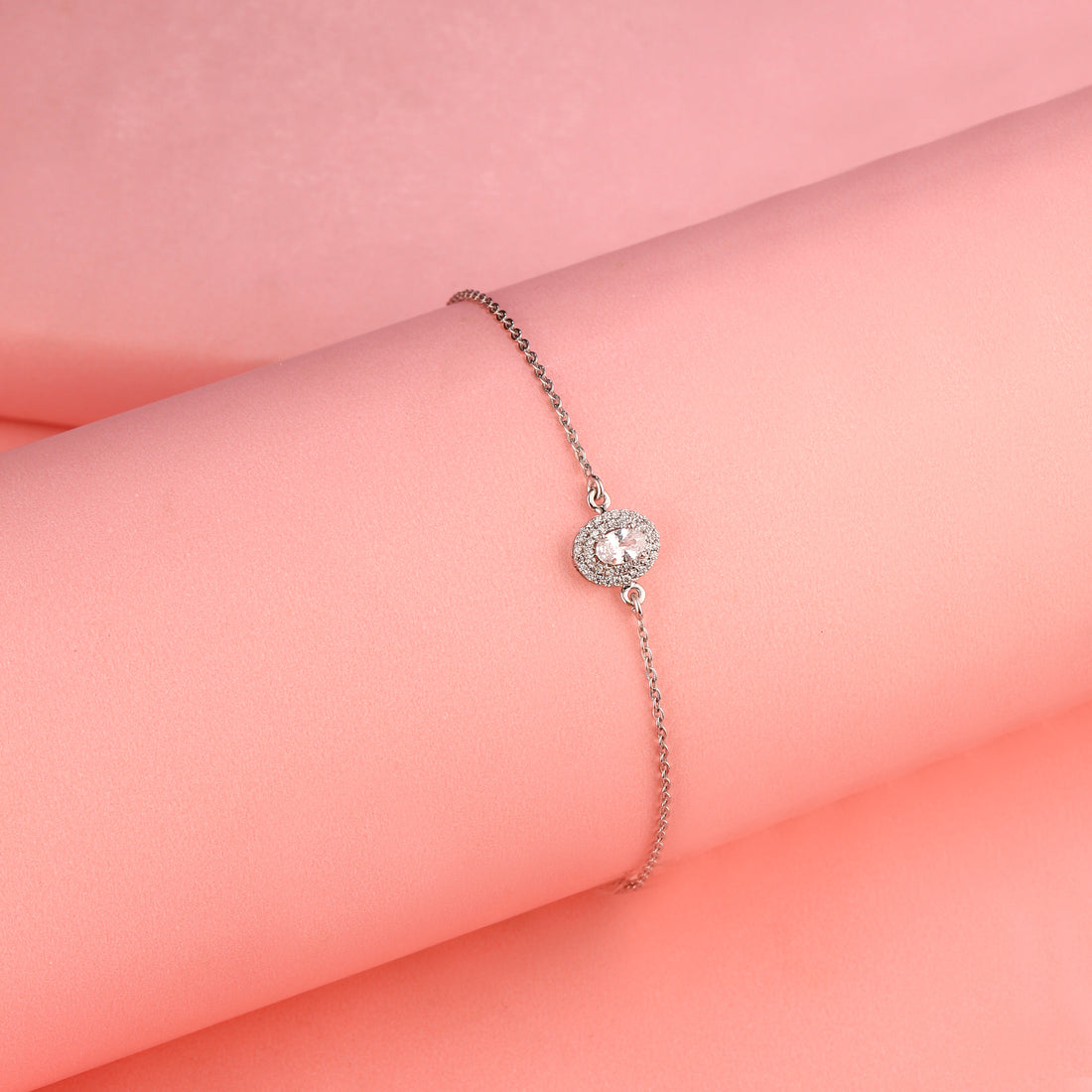 925 silver halo bracelet worn on pink background
