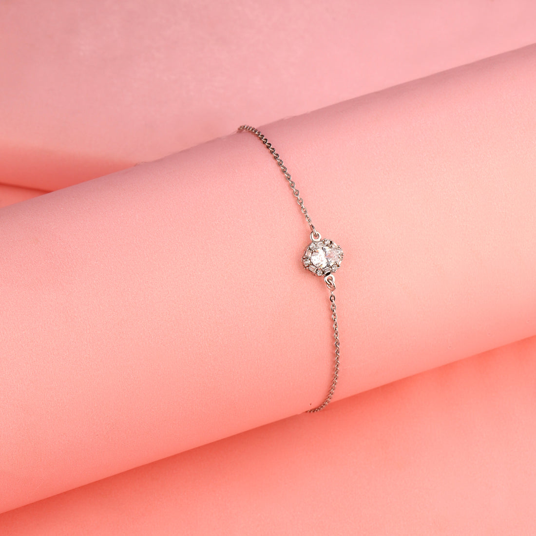 925 silver halo bracelet against soft pink background