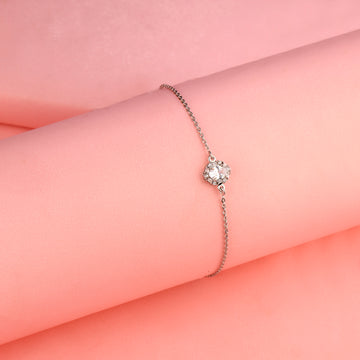 925 silver halo bracelet against soft pink background