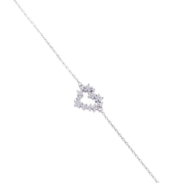Close-up of floral heart cubic zirconia charm in 925 silver bracelet