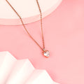 925 silver rose gold heart pendant with double loop detail on pink background