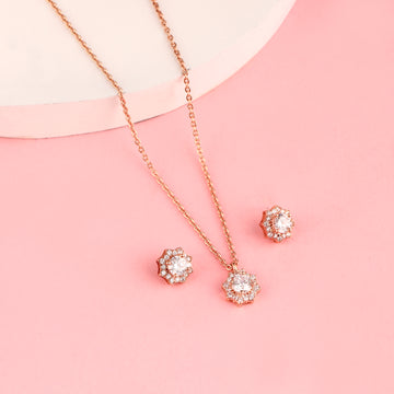 Rose gold floral halo pendant set in 925 silver with zircon stones displayed on soft pink background