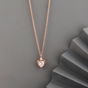 Rose gold 925 silver heart solitaire pendant necklace styled on grey background