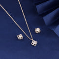 925 silver clover halo pendant set with zircon stones displayed on blue fabric background