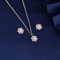 925 silver snowflake cluster pendant set displayed on blue fabric background