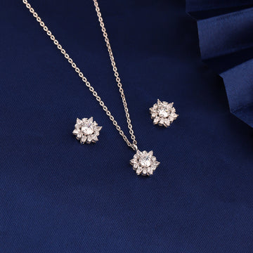 925 silver snowflake cluster pendant set displayed on blue fabric background