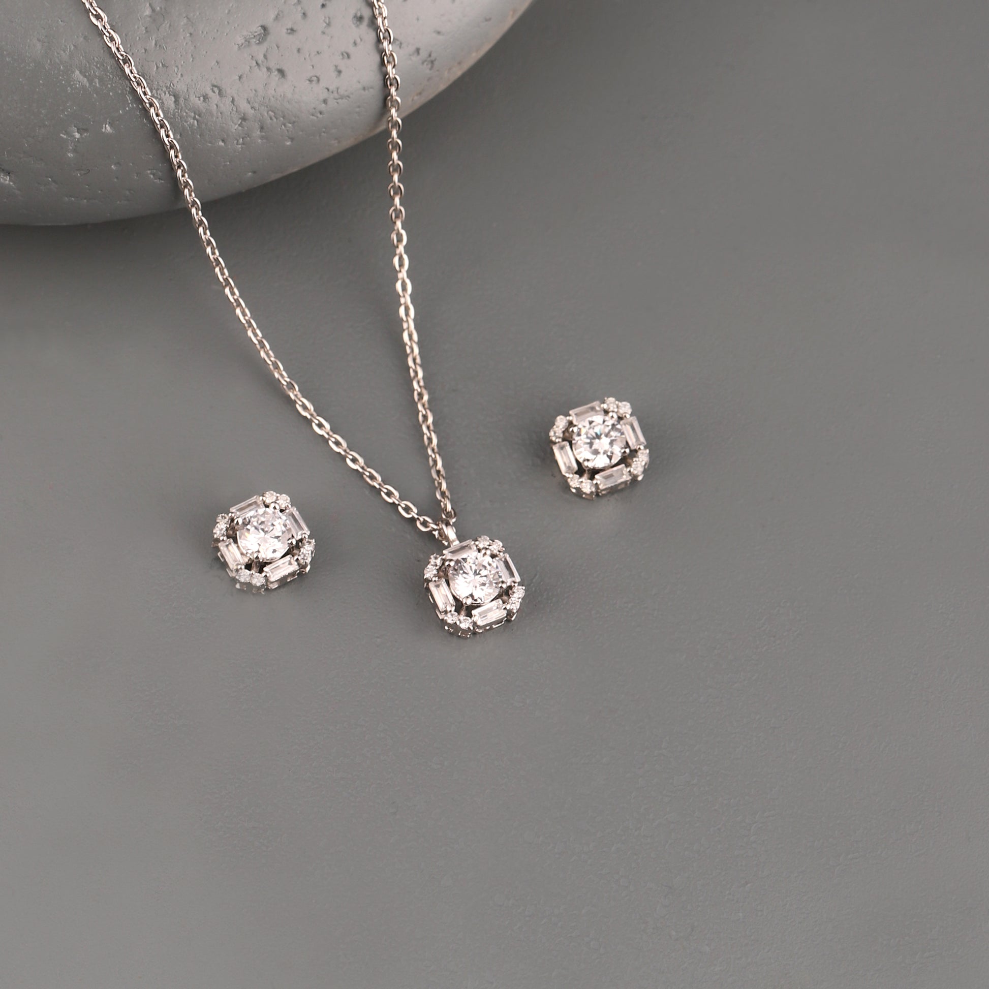 925 silver geometric baguette pendant set with zircon stones on grey background