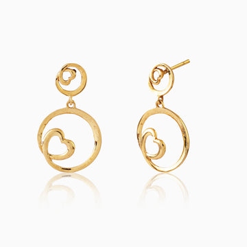 Angled side view of 925 silver golden heart swirl earrings highlighting polished finish and structure
