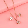 Rose gold floral 925 silver pendant and earrings set styled on pink background