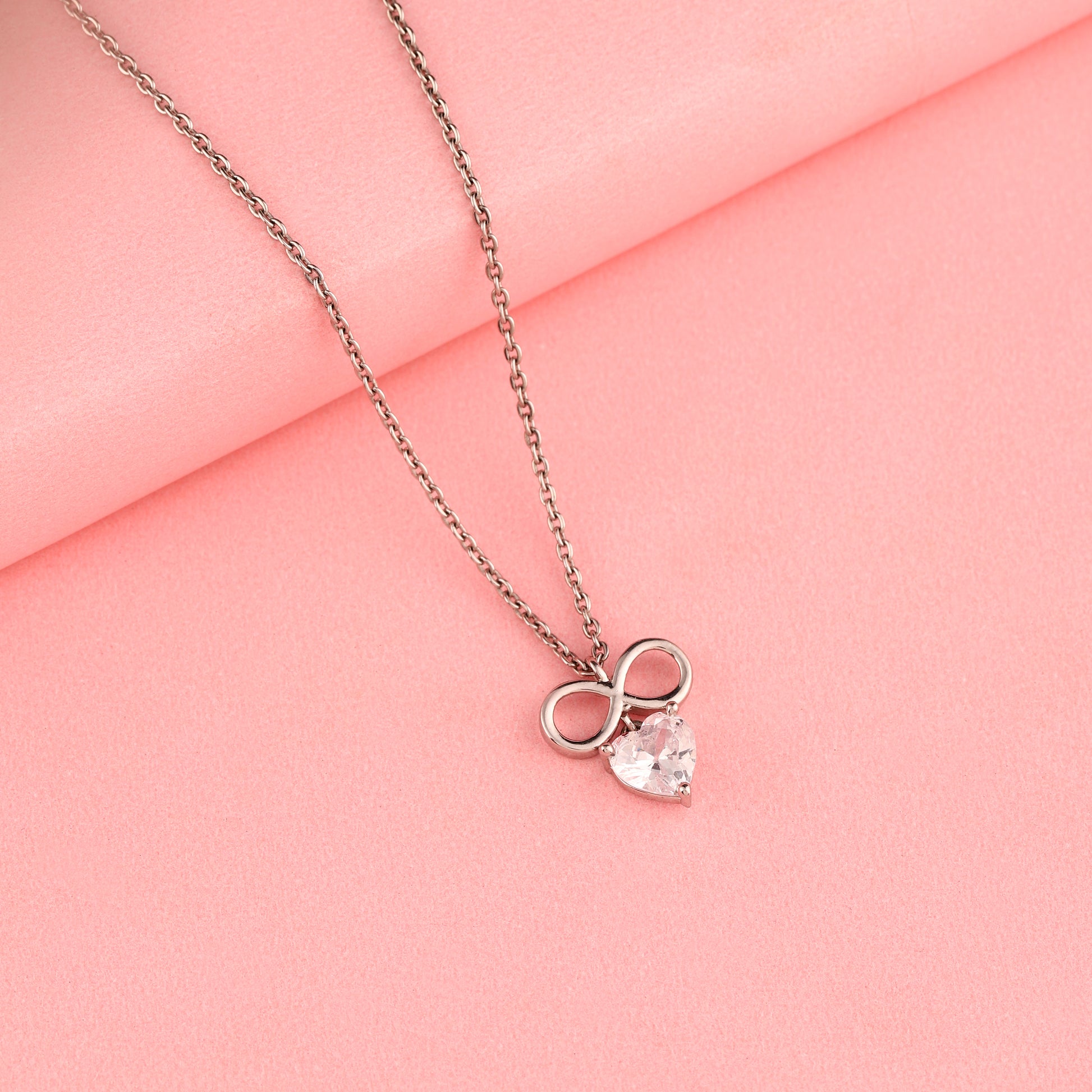 Infinity symbol 925 silver necklace with heart-cut drop detail