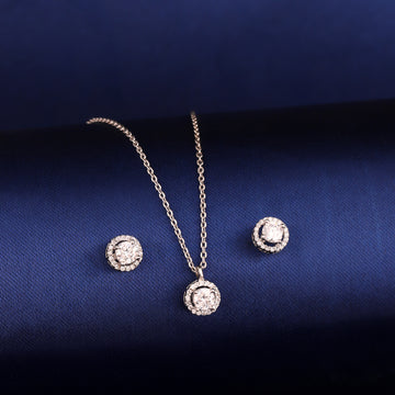 Round halo 925 silver pendant and earrings styled on dark background