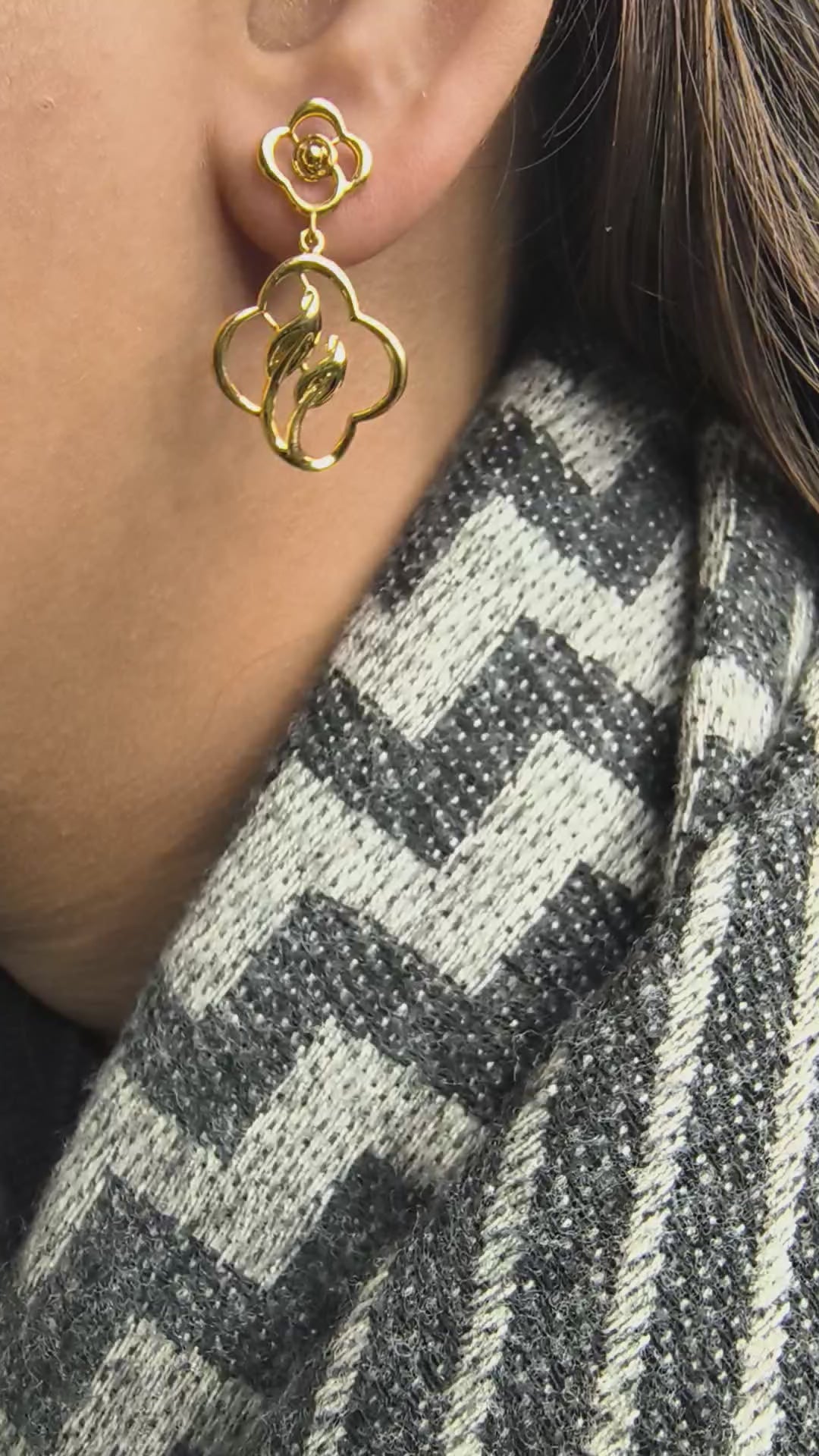 Close-up of 925 silver golden bloom petal drop earrings worn on ear showcasing elegant floral drop silhouette