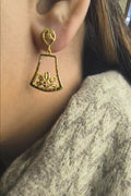 Close-up of 925 silver golden lotus bloom drop earrings worn on ear highlighting elegant traditional design