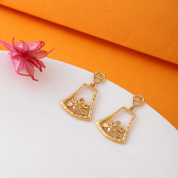 925 silver golden lotus bloom geometric drop earrings with open-frame design on orange background